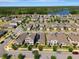 This aerial view shows a residential neighborhood with a nearby body of water at 9456 Komika Ln, Winter Garden, FL 34787