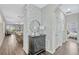 Inviting hallway with decorative accents, wood floors, and an open view to dining and living areas at 9456 Komika Ln, Winter Garden, FL 34787