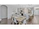 Open-concept kitchen and dining area featuring updated appliances and stylish furnishings at 9456 Komika Ln, Winter Garden, FL 34787