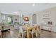 Open living space with dining area, wood floors, and plenty of natural light at 9456 Komika Ln, Winter Garden, FL 34787