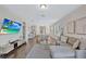 Bright and spacious living room seamlessly connects to the kitchen and dining areas at 9456 Komika Ln, Winter Garden, FL 34787
