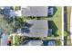 An aerial view of houses showing roof types and landscaping in a well-maintained neighborhood at 9736 Heron Pointe Dr, Orlando, FL 32832