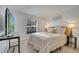 Bright bedroom with neutral walls, plush carpet, and a large window at 9736 Heron Pointe Dr, Orlando, FL 32832