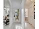 Bright foyer featuring decorative glass front door leading to dining room and bedroom at 9736 Heron Pointe Dr, Orlando, FL 32832