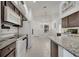 Bright kitchen with granite countertops, white appliances, and ample cabinet space at 9736 Heron Pointe Dr, Orlando, FL 32832