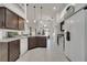 Spacious kitchen with modern appliances, granite countertops, and dark wood cabinetry at 9736 Heron Pointe Dr, Orlando, FL 32832