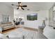 Bright living room with hardwood floors, neutral-toned furniture, and an adjacent open-concept kitchen at 9736 Heron Pointe Dr, Orlando, FL 32832