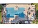 An aerial shot showcasing a community pool with lounge chairs and decorative water features at 9736 Heron Pointe Dr, Orlando, FL 32832