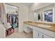 Bathroom with a walk-in closet and vanity at 976 W Gaucho Cir, Deltona, FL 32725