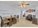 Open floor plan showing a dining space with a ceiling fan and tiled flooring at 976 W Gaucho Cir, Deltona, FL 32725