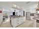 Open kitchen with a large island providing extra storage and prep space, stainless appliances, and barstool seating at 976 W Gaucho Cir, Deltona, FL 32725
