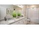 This primary bathroom features double sinks, granite counters, and a separate tub/shower at Tbd Royal Trails Rd, Eustis, FL 32736
