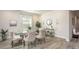 Inviting dining room with an elegant table setting, stylish chairs, and natural light at Tbd Royal Trails Rd, Eustis, FL 32736