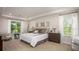 This spacious main bedroom features neutral decor, a tray ceiling and a large window at Tbd Royal Trails Rd, Eustis, FL 32736