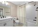 Well-lit bathroom with a shower-tub combination and modern white vanity at 10215 Park Estates Ave, Orlando, FL 32836