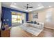 Open living room with a ceiling fan, sliding doors, and wood-look floors at 10215 Park Estates Ave, Orlando, FL 32836