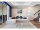Open living room with a ceiling fan, sliding doors, and wood-look floors at 10215 Park Estates Ave, Orlando, FL 32836