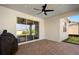 Covered patio features ceiling fan, and outdoor kitchen area at 10215 Park Estates Ave, Orlando, FL 32836