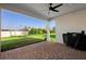 Covered patio with ceiling fan overlooks backyard at 10215 Park Estates Ave, Orlando, FL 32836