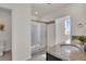 Bathroom with a glass shower, granite vanity, and a well-lit interior at 1068 Brooklet Dr, Davenport, FL 33837