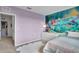 Adorable themed bedroom features a mural, carpet, and white furniture at 1068 Brooklet Dr, Davenport, FL 33837