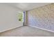 Comfortable bedroom featuring a whimsical wallpaper accent wall and a bright window at 1068 Brooklet Dr, Davenport, FL 33837