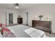 Well-lit bedroom with decorative lamps on dresser, large window, and neutral carpet at 1068 Brooklet Dr, Davenport, FL 33837