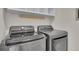 Modern laundry room equipped with a gray LG washer and dryer at 1068 Brooklet Dr, Davenport, FL 33837