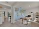 Bright office space features a large world map, desk, and comfortable seating at 1068 Brooklet Dr, Davenport, FL 33837