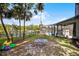 Expansive backyard featuring a playset and a screened pool area, perfect for outdoor enjoyment at 107 Coveridge Ln, Longwood, FL 32779