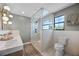 Bright bathroom featuring a glass shower and double vanity with marble countertops at 107 Coveridge Ln, Longwood, FL 32779
