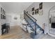 Inviting entryway with wood-look flooring, charming decor, and stairway with carpet at 107 Coveridge Ln, Longwood, FL 32779