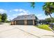 Large three-car garage featuring a pool with screened enclosure and waterfront views at 107 Coveridge Ln, Longwood, FL 32779