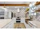 Elegant kitchen with white cabinets, marble countertops, and stainless steel appliances at 107 Coveridge Ln, Longwood, FL 32779