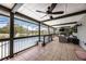 Spacious screened-in outdoor living space with comfortable seating, overlooking the pool and lake at 107 Coveridge Ln, Longwood, FL 32779