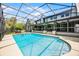 Beautiful backyard oasis showcasing a screened pool with a view of the house at 107 Coveridge Ln, Longwood, FL 32779