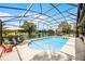 Sparkling screened pool area with lounge chairs and lush landscaping offers a relaxing outdoor experience at 107 Coveridge Ln, Longwood, FL 32779