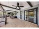 Spacious screened patio featuring tiled flooring, a ceiling fan, and comfortable seating area at 107 Coveridge Ln, Longwood, FL 32779