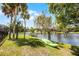 Waterfront property with lush lawn and lake views at 107 Coveridge Ln, Longwood, FL 32779