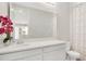Bathroom featuring a single sink vanity with a large mirror and a shower with patterned curtain at 1090 Wildmeadow Run, Winter Park, FL 32792