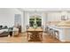 Open-concept dining area with hardwood floors and ample natural light at 1090 Wildmeadow Run, Winter Park, FL 32792