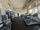 A bright fitness center features modern exercise equipment, large windows, and ample space for a complete workout at 1090 Wildmeadow Run, Winter Park, FL 32792