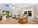 Bright and airy living room featuring tall ceilings and large windows at 1090 Wildmeadow Run, Winter Park, FL 32792