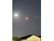 An image of the night sky showcases a celestial event, with a bright moon and shooting star above a roofline at 1090 Wildmeadow Run, Winter Park, FL 32792