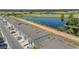 Aerial view of the townhome community featuring water views, pond, and the golf course at 1121 Blue Jay Dr, Davenport, FL 33837