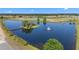 Scenic aerial view of a beautiful pond and golf course in the Ridgewood Lakes Del Webb community at 1121 Blue Jay Dr, Davenport, FL 33837