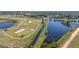 Picturesque aerial view of a golf course and scenic water features throughout the community at 1121 Blue Jay Dr, Davenport, FL 33837