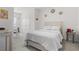 Inviting bedroom with neutral tones, featuring a comfortable bed and ample natural light at 1121 Blue Jay Dr, Davenport, FL 33837