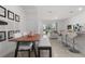 Open dining area with modern decor flowing seamlessly into the bright living space at 1121 Blue Jay Dr, Davenport, FL 33837