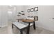 Charming dining area featuring a modern table, stylish decor, and easy access to other areas of the home at 1121 Blue Jay Dr, Davenport, FL 33837